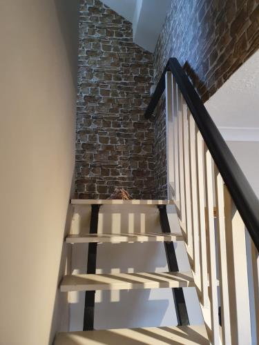stairs with brick wall paper