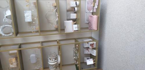 Fitting shelving in a bridal shop 